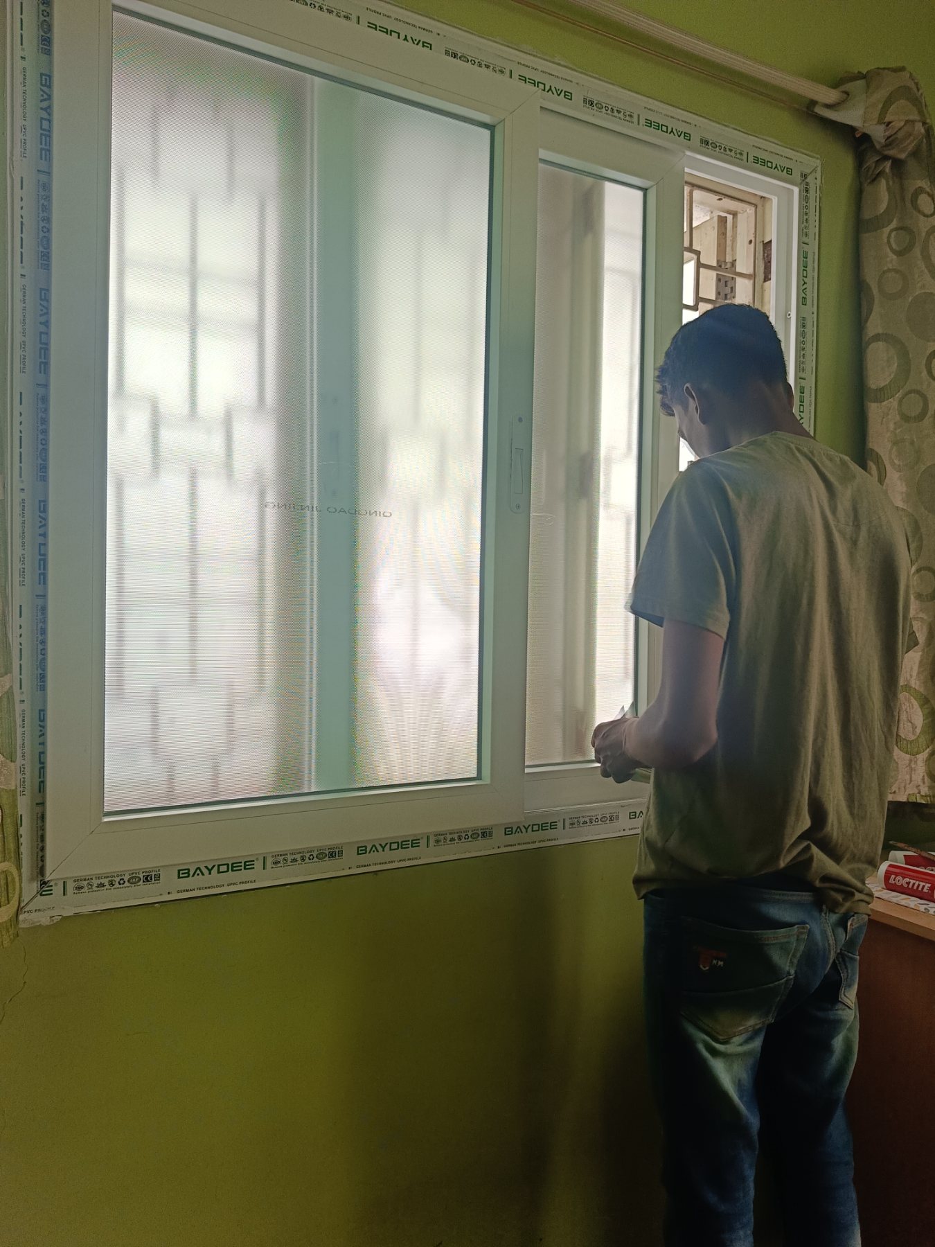uPVC Sliding Window Installation with Mosquito Mesh at Bohra Layout, Bengaluru - Kutbi Aluminium Glass & Hardware
